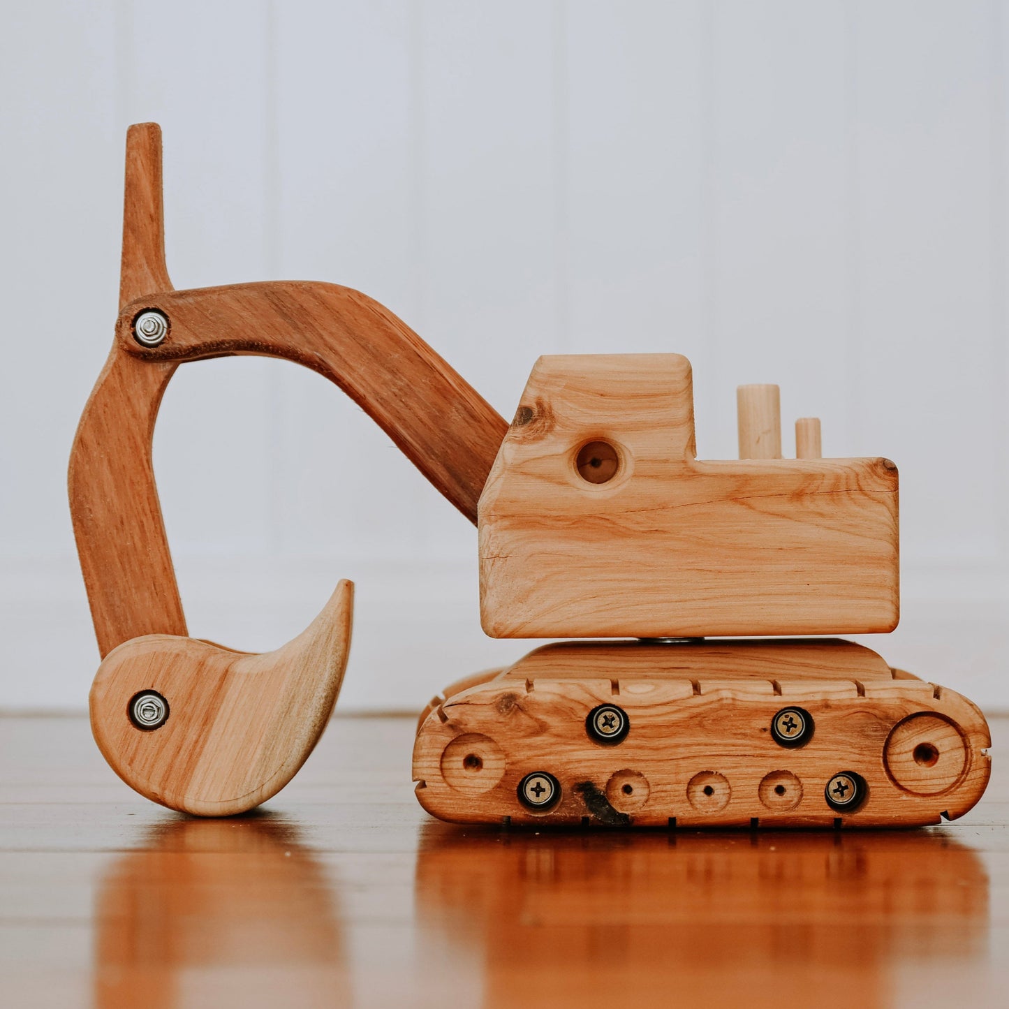A luxurious and prestigious Handmade Heirloom Wooden Digger. Showing functionality of rotating cab, and working arm and boom