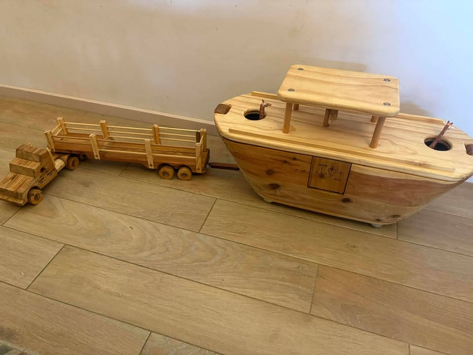 Ballard Bear build Ark Heirloom Build with Custom personalisation. Fold down door that acts as a ramp. Wheels for transport. Double Decker with pens and working steering wheel. Hitches to a custom low loader and becomes a road train behind a stock crate trailer