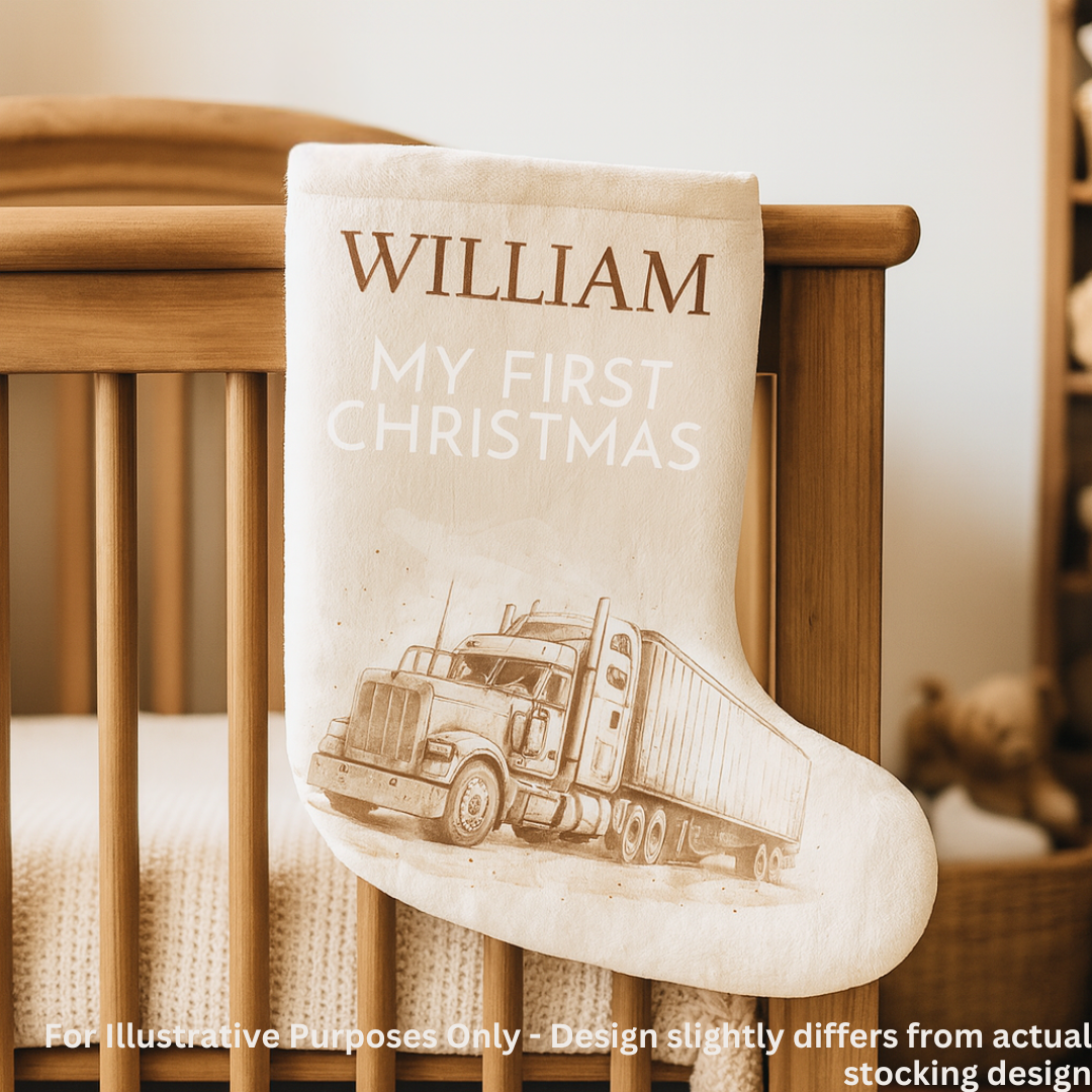 Personalized Christmas stocking with 'My First Christmas' text and truck design, hanging in a crib.