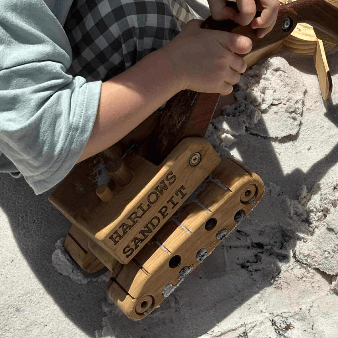 2 year old boy, playing in sand pit wit his personalised Ballard Bear heirloom excavator digger