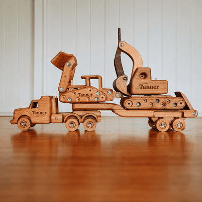 Wooden toy construction set with 'Tanner' branding on a wooden surface.