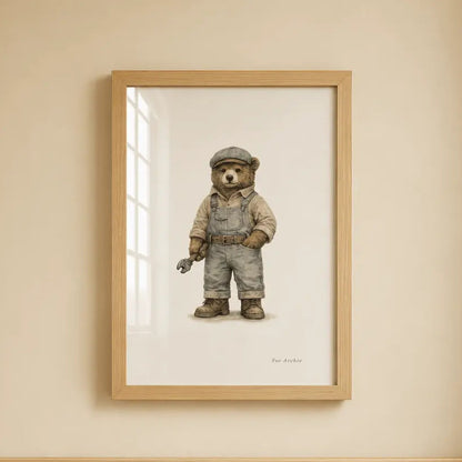 A framed art print of a teddy bear dressed as a Low Loader  worker hanging on a beige wall above a light wood crib.