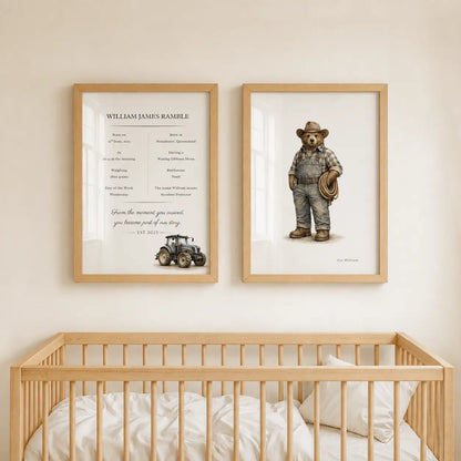 Two framed personalized prints hanging on a beige wall above a wooden crib. The left print is a minimalist memorial-style design with a tractor illustration and the text 'WILLIAM JAMES RAMBLE' and 'EST . 2015. Tractor Collection