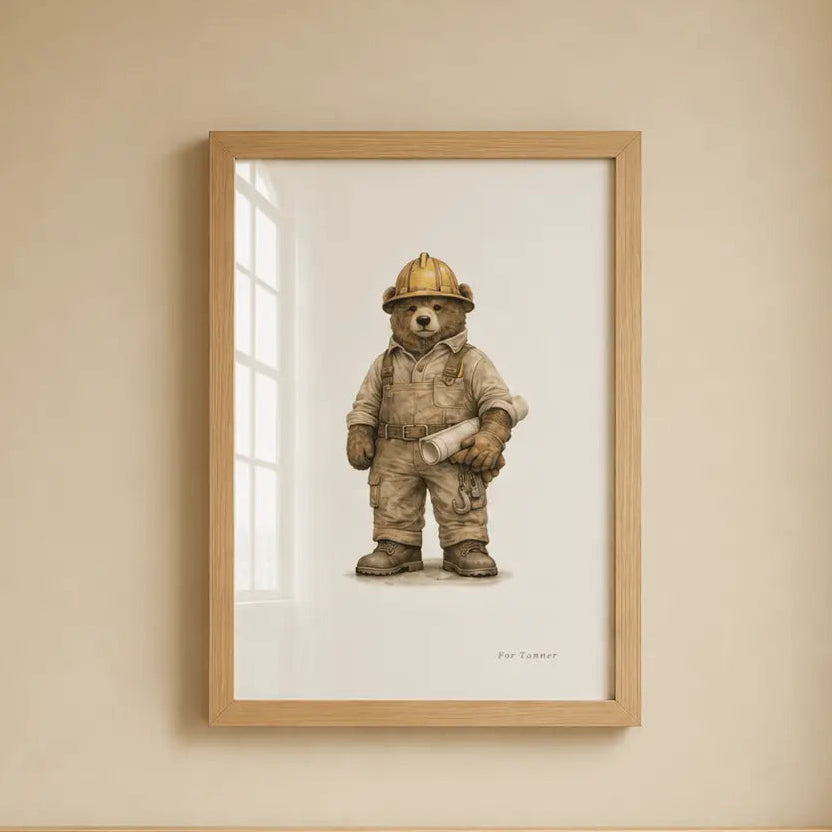 A framed art print of a construction or operator bear hanging on a beige wall above a light wood crib. bulldozer  