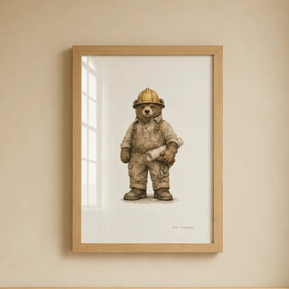 A framed art print of a construction or operator bear hanging on a beige wall above a light wood crib. bulldozer  