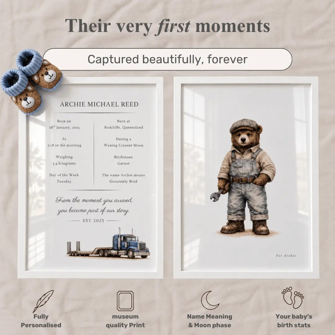 Personalized framed baby milestone prints displayed side by side on a beige fabric background. The left print features a baby boot and booties with birth details for Archie Michael Reed, and the right print shows a teddy bear dressed as a Low Loader driver holding a spanner. Low Loader  Collection