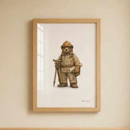A framed art print of a excavator bear hanging on a beige wall above a light wood crib.